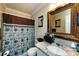 Bathroom with a decorative mirror, single sink, and a shower with curtain at 6421 Hidden Forest Dr, Charlotte, NC 28213
