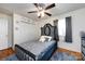 This bedroom features a modern ceiling fan and a luxurious, padded headboard at 6421 Hidden Forest Dr, Charlotte, NC 28213