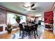 Warm dining space with wood floors and an open layout connecting to the kitchen at 6421 Hidden Forest Dr, Charlotte, NC 28213