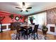 Cozy dining area with a wood table, brick accent wall, and natural light from large windows at 6421 Hidden Forest Dr, Charlotte, NC 28213