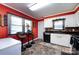 Compact kitchenette featuring a breakfast bar, and tiled backsplash, perfect for casual dining at 6421 Hidden Forest Dr, Charlotte, NC 28213