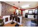 Bright kitchenette with a breakfast bar, pendant lighting, and stylish brick backsplash at 6421 Hidden Forest Dr, Charlotte, NC 28213