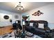 Spacious living room featuring wood floors, fresh paint, modern decor, recessed lighting, and an open layout at 6421 Hidden Forest Dr, Charlotte, NC 28213
