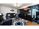 Well-lit living room featuring hardwood floors, fresh paint, recessed lighting, and an open layout to maximize space at 6421 Hidden Forest Dr, Charlotte, NC 28213
