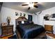 Comfortable main bedroom featuring a large bed, ceiling fan, and closet at 6421 Hidden Forest Dr, Charlotte, NC 28213