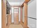 Walk-in closet featuring custom wood shelving, drawers and hanging space to provide optimized, organized storage at 715 N Graham St # 207, Charlotte, NC 28202