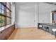 Bright living space with light wood floors, high ceilings, oversized windows and counter seating at 715 N Graham St # 207, Charlotte, NC 28202