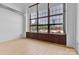 Bright living space with light wood floors, high ceilings, and oversized windows at 715 N Graham St # 207, Charlotte, NC 28202