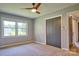 Bedroom with natural light, a ceiling fan, and a gray closet door at 7753 Caswell Rd, Stanley, NC 28164