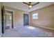 Bedroom with carpet, closet, and two windows letting in natural light at 7753 Caswell Rd, Stanley, NC 28164