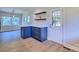 Charming breakfast nook with navy blue cabinets, quartz countertops, and lots of natural light at 7753 Caswell Rd, Stanley, NC 28164