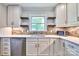 Bright, updated kitchen with stainless steel appliances and a modern backsplash at 7753 Caswell Rd, Stanley, NC 28164