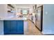 Modern kitchen featuring white cabinetry, stainless steel appliances, and stone countertops at 7753 Caswell Rd, Stanley, NC 28164