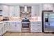 Well-lit kitchen showcasing stainless steel appliances and updated countertops, ideal for cooking at 7753 Caswell Rd, Stanley, NC 28164