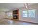 Spacious living room with fireplace and updated flooring at 7753 Caswell Rd, Stanley, NC 28164