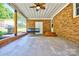 Outdoor patio with brick wall, porch swing, and covered area perfect for relaxation at 7753 Caswell Rd, Stanley, NC 28164