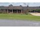 Charming brick ranch home with a cozy front porch, carport, and a well-maintained front yard at 114 Joe Teague Rd, Hickory, NC 28601