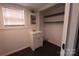 Small bathroom with a white vanity, mirror, shelving, and dark floor at 1257 Reese Roach Rd, Rock Hill, SC 29730