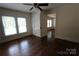 Bright bedroom featuring hardwood floors, two windows, and closet storage with door to adjacent room at 1257 Reese Roach Rd, Rock Hill, SC 29730