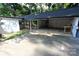 View of the attached carport with a porch swing and adjacent storage or workspace at 1257 Reese Roach Rd, Rock Hill, SC 29730