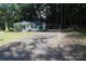 Charming white house featuring a spacious driveway and a large carport at 1257 Reese Roach Rd, Rock Hill, SC 29730