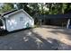View of the side of the home with the carport and the side yard with black mulch at 1257 Reese Roach Rd, Rock Hill, SC 29730
