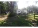 Charming home with white siding, wooden fence, and mature trees at 1257 Reese Roach Rd, Rock Hill, SC 29730