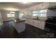 Modern kitchen featuring granite counters, white cabinetry, and stainless steel appliances at 1257 Reese Roach Rd, Rock Hill, SC 29730