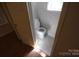 View of half bath showcasing toilet and new tile flooring; accessed through open door at 1257 Reese Roach Rd, Rock Hill, SC 29730