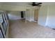 Bright sunroom featuring wood-look floors, white brick accent wall, and windows on three sides at 1257 Reese Roach Rd, Rock Hill, SC 29730