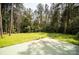 Large backyard with a patio and wooded perimeter providing privacy at 164 Pleasant Creek Dr, Cleveland, NC 27013