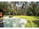 Expansive backyard with a patio, lush lawn, and wooded backdrop at 164 Pleasant Creek Dr, Cleveland, NC 27013