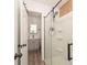Well-lit bathroom featuring a sleek vanity, neutral finishes, and a glass-enclosed shower at 164 Pleasant Creek Dr, Cleveland, NC 27013
