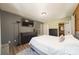 Comfortable bedroom featuring a queen bed, gray accent wall, and mounted TV at 164 Pleasant Creek Dr, Cleveland, NC 27013