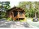 View of charming cabin with log siding and a covered porch at 164 Pleasant Creek Dr, Cleveland, NC 27013