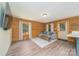 Cozy living room with wood-paneled walls and hardwood flooring, modern furniture and decor at 164 Pleasant Creek Dr, Cleveland, NC 27013