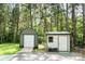 Two storage sheds located in a wooded area at 164 Pleasant Creek Dr, Cleveland, NC 27013