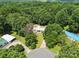 Aerial view of the house nestled within a densely wooded area, offering privacy at 222 Laramie Dr, Stanley, NC 28164