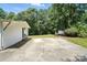 Wide paved area in back with ample yard at 222 Laramie Dr, Stanley, NC 28164