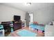 Comfortable bedroom featuring a twin bed, dresser, and organized storage, with a warm and inviting feel at 222 Laramie Dr, Stanley, NC 28164
