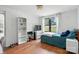 Bright bedroom with natural light, warm wood floors, and practical storage shelves at 222 Laramie Dr, Stanley, NC 28164
