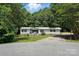 Inviting single-story home with a well-manicured lawn and long driveway at 222 Laramie Dr, Stanley, NC 28164