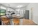 Open kitchen with white cabinets and breakfast bar, seamlessly connecting to living spaces at 222 Laramie Dr, Stanley, NC 28164