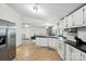 Functional kitchen featuring white cabinets, stainless steel fridge, and open layout at 222 Laramie Dr, Stanley, NC 28164