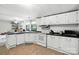 Cozy kitchen with white appliances and ample cabinet space, perfect for cooking at 222 Laramie Dr, Stanley, NC 28164