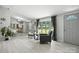 Charming living room with light gray wood floors and abundant natural light from large windows at 222 Laramie Dr, Stanley, NC 28164