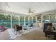 Relaxing screened porch featuring comfortable wicker seating and peaceful outdoor views at 222 Laramie Dr, Stanley, NC 28164