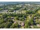 A bird's eye view captures the home's setting within a vibrant, tree-filled community at 2680 Heavens Ct, Fort Mill, SC 29715