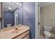Cozy bathroom featuring colorful floral wallpaper and a vanity at 2680 Heavens Ct, Fort Mill, SC 29715