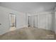 Neutral bedroom with carpet, a closet, and an adjacent bathroom at 2680 Heavens Ct, Fort Mill, SC 29715